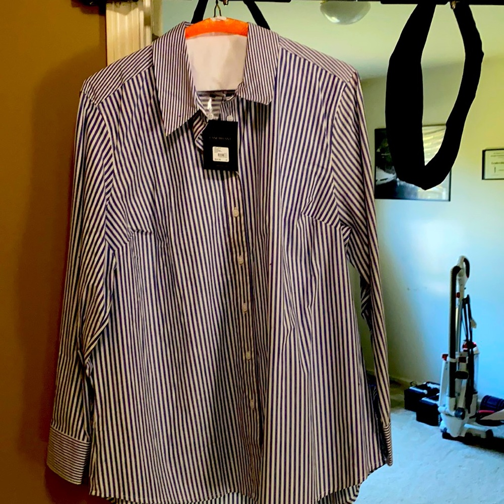 Size 18 Brand new button down shirt. Tags still on.